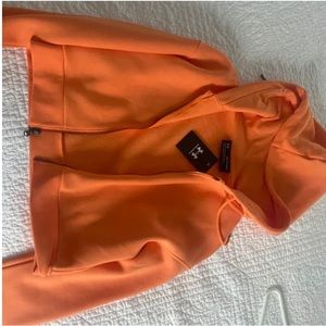 orange zip up